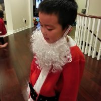 Marcus trying out Santa's beard